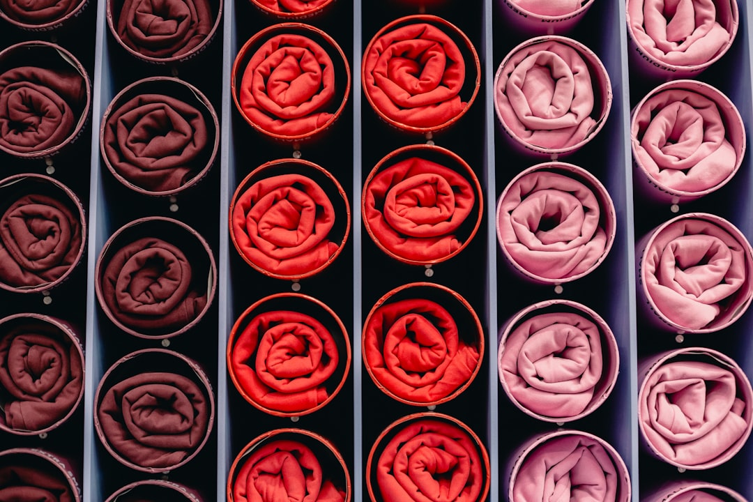 rolled-fabric-swatches-in-shades-of-red-and-pink-puvw5-fbxcs